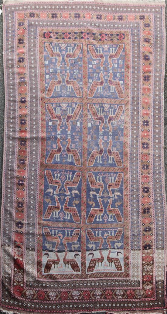 A Turkish rug, 9ft 6in by 5ft 4in.
